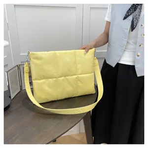 Yellow quilted crossbody bag for women, soft padded shoulder bag with wide strap casual use.