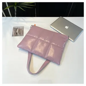 Padded quilted laptop shoulder bag detail shot, glossy purple design for 15.6 inch notebooks.