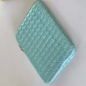 Mint green quilted tablet sleeve with cute heart pattern, perfect for 11/13 inch laptops.