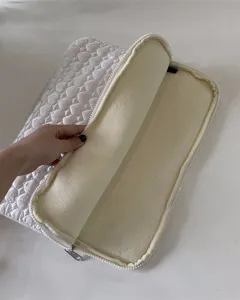 White quilted laptop sleeve detail, soft plush interior lining for 11 13 inch tablet storage.