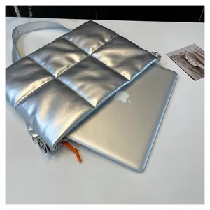 Silver padded laptop bag detail, space cotton notebook sleeve for 15.6 inch MacBook PC.