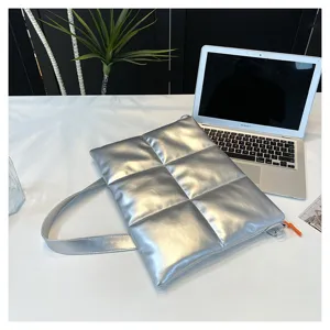 Silver puffy quilted laptop shoulder bag, stylish padded messenger bag for everyday use and travel