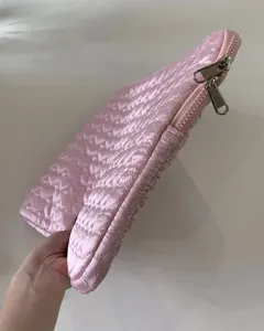 Pink quilted tablet sleeve detail, cute heart pattern design with smooth metal dual zippers.