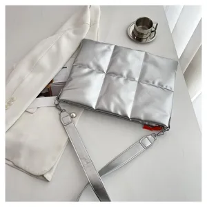 Silver quilted laptop bag detail view, stylish puffer sleeve and sleek crossbody design for everyday use.