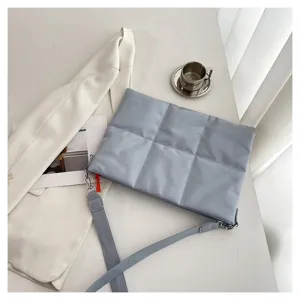 Light blue quilted laptop bag with shoulder strap, padded cloud bag suitable for 15.6 inch daily use.
