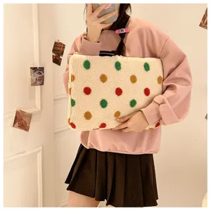 Fluffy sherpa laptop sleeve with colorful polka dots, soft zipper tablet storage bag for daily use.