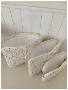 Korean floral quilted laptop sleeve and storage pouch set, lightweight and stylish design.