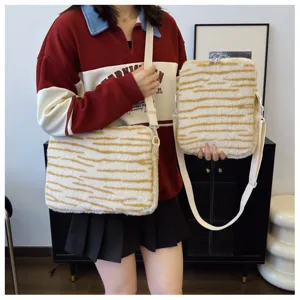 Fluffy tiger stripe shoulder bag detail showing soft plush material and adjustable strap for daily use.