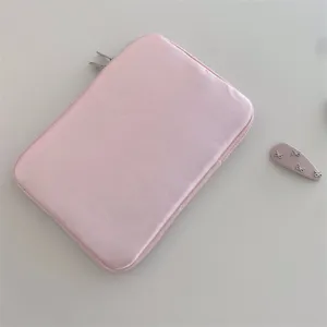 Pink cute laptop sleeve case for iPad and notebook with bow accessory, portable storage bag.
