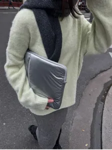 Silver 14-inch laptop sleeve detail, stylish Y2K metallic finish portable tablet inner bag.