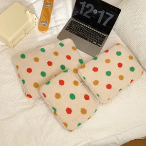 Cute fluffy fleece laptop sleeve and tablet storage bag with colorful polka dot design.