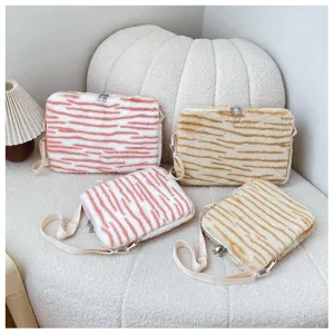 Fluffy plush tiger stripe shoulder bag, soft tablet and laptop sleeve detail view.