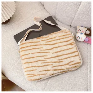 Fluffy tiger stripe laptop sleeve detail, soft faux fur tablet bag with adjustable shoulder strap.