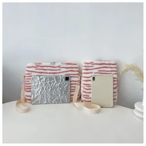 Detailed view of fluffy tiger stripe tablet sleeve and shoulder bag, cute winter fuzzy case.