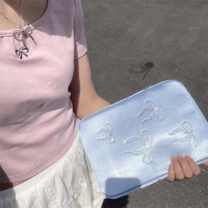 Detailed shot of cute rhinestone bow laptop sleeve tablet storage bag for 11 13 15 inch notebooks.