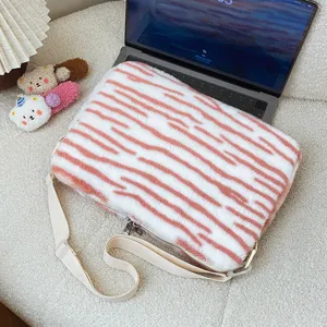 Fluffy tiger stripe laptop shoulder bag, soft plush sleeve for 14 inch computer and tablet storage.
