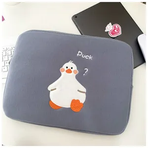 Grey tablet sleeve with cute duck embroidery, soft protective case for iPad and laptop use.