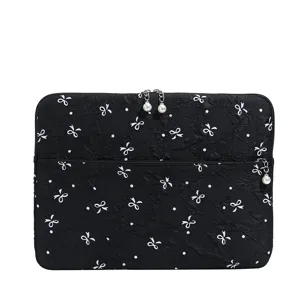 Housse d'ordinateur portable noire avec nœuds blancs et pois, fermeture éclair perle, poche.