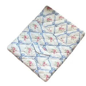 Quilted laptop sleeve with blue ribbon and pink rose floral print, cute tablet storage bag.