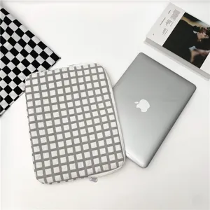 Korean style plaid plush lined laptop sleeve and tablet protective bag top view display.