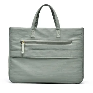 Minimalist commuter women handbag laptop tote bag in sage green with front zipper pocket.