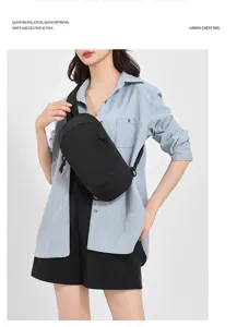 Detail view of the stylish black chest bag, showing durable fabric and convenient crossbody strap.