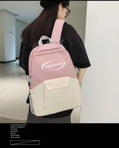 Casual canvas school backpack for students, pink and beige colorblock design for daily travel.