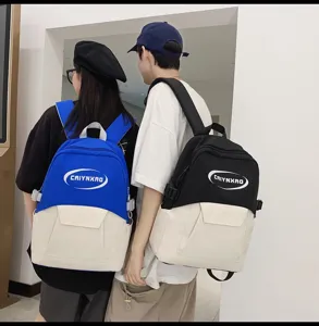 Detailed view of trendy Korean style casual campus backpack with color block design.