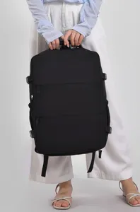 Black travel backpack detail showing large capacity, multi-functional storage and side straps.