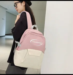 Korean style pink and white casual backpack for student school and daily travel use.