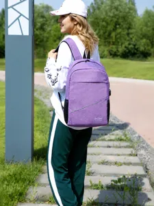 Detailed view of the purple large capacity multi-compartment travel backpack outdoor bag.