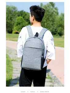 Casual grey travel backpack with USB charging port, large capacity school bag for daily use.
