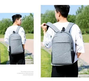 Casual grey backpack for men and women, large capacity travel laptop school bag daily use.