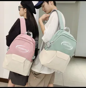 Stylish campus casual backpack for men and women, color-block travel school book bag.