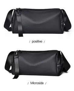 Gros plan détaillé montrant clairement le sac bandoulière cylindrique noir élégant.