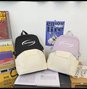 Casual dual-color canvas school backpack with front pocket and comfortable adjustable shoulder straps.