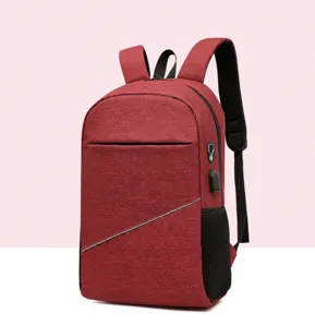 Red multi-functional casual backpack detail, features USB charging port and secure reflective strip.