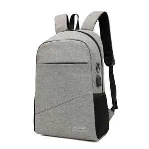 Grey casual laptop backpack with USB charging port, large capacity school bag for daily use.