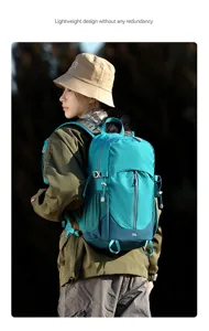 Detail view of the teal 25L outdoor hiking backpack worn outdoors, lightweight and practical.