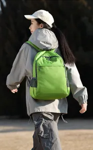 Outdoor hiking backpack detail shot, showing green foldable daypack design with side mesh pockets.
