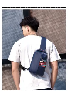 Detailed view of men's casual sling chest bag in deep blue with colorful leaf print pocket.