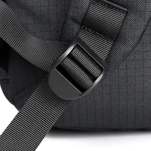 Backpack strap and buckle detail view showing durable material and adjustable design for use.