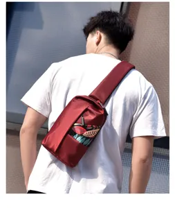 Men's casual crossbody chest bag detail view, showing the stylish leaf pattern design.