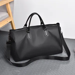 Black large capacity gym travel duffel bag with shoulder strap, solid color casual sports handbag.