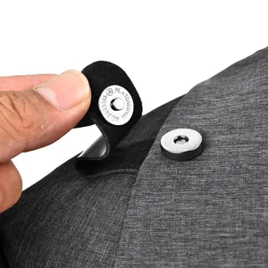 Close-up detail of grey waterproof chest bag magnetic snap closure, durable outdoor gear.