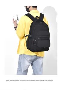 Detailed view of the black multi-pocket backpack worn by model, showing casual daily style.