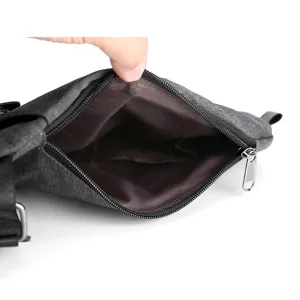Close-up view of the men water-resistant chest bag interior pocket and smooth zipper details.