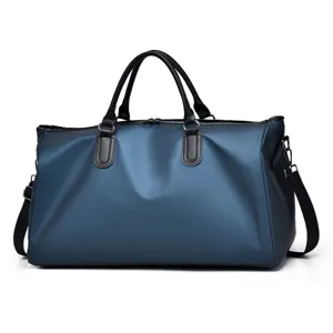 Detail view of large capacity waterproof travel duffel bag with black handles and strap.