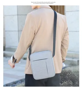 Lightweight grey nylon crossbody bag detail shot, compact daily travel shoulder bag.