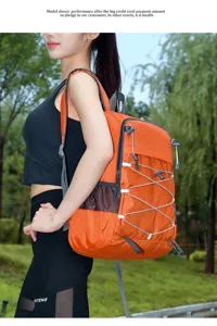 Lightweight orange foldable travel backpack with mesh pockets for outdoor sports.